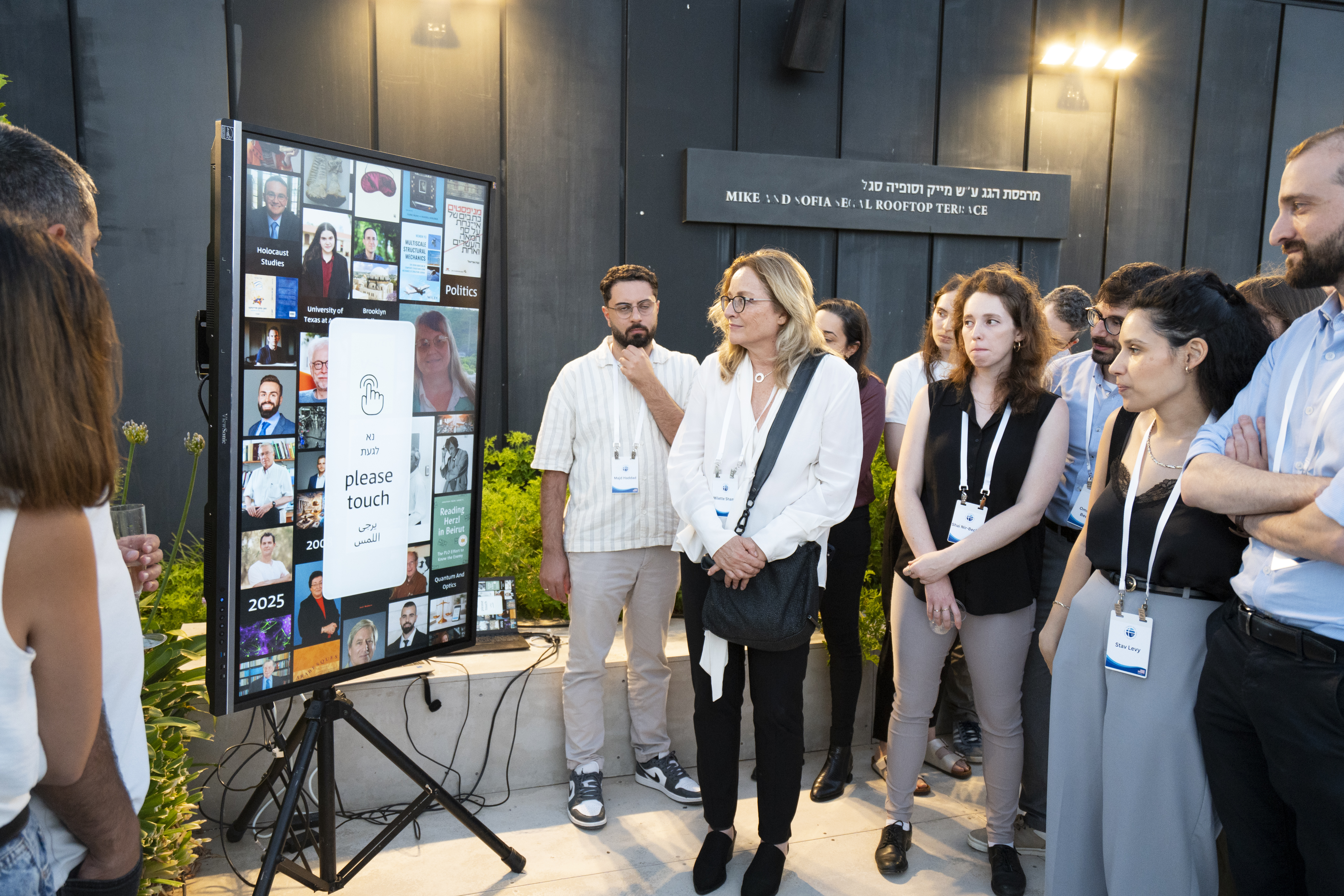 2026 Annual Dinner - Millette Shamir looking at exhibition